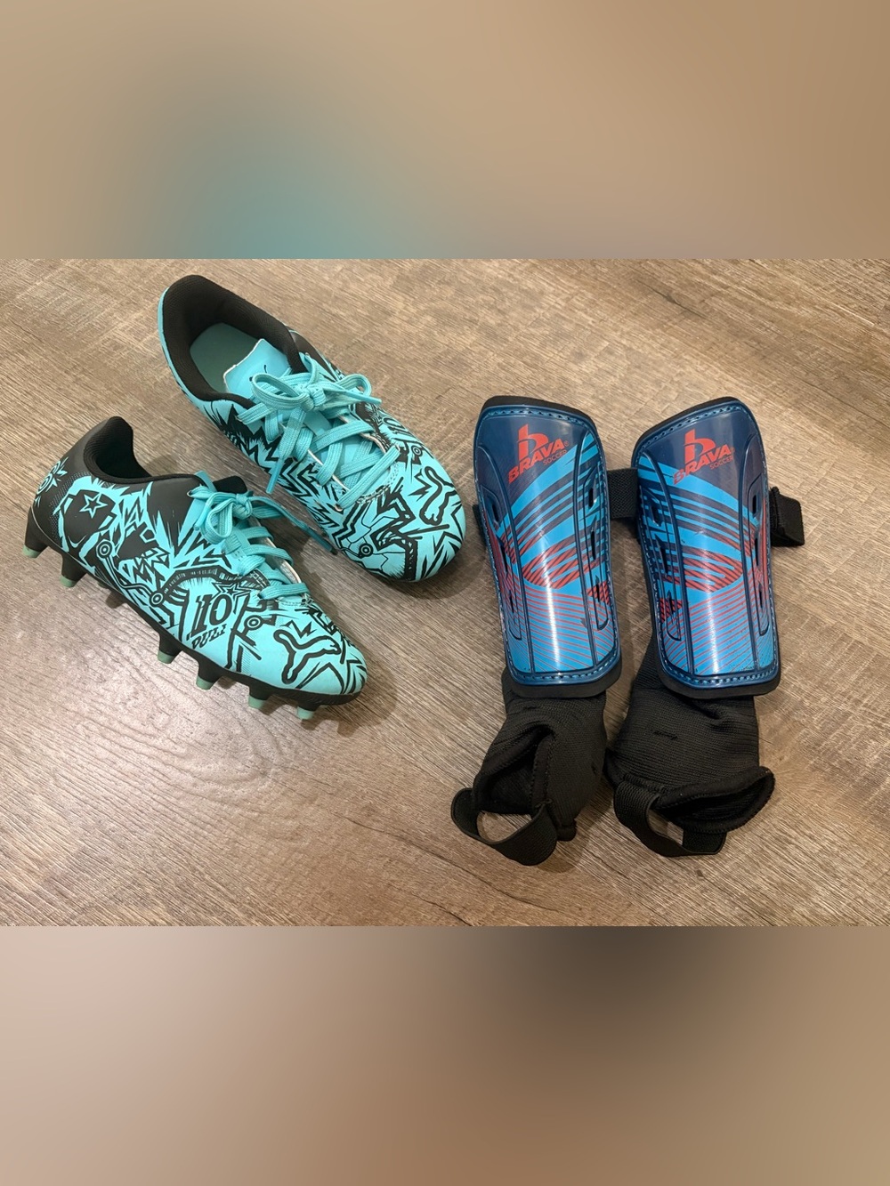 Puma Child Tacto Christian Pulisic Firm Soccer Cleats & Shin Guards